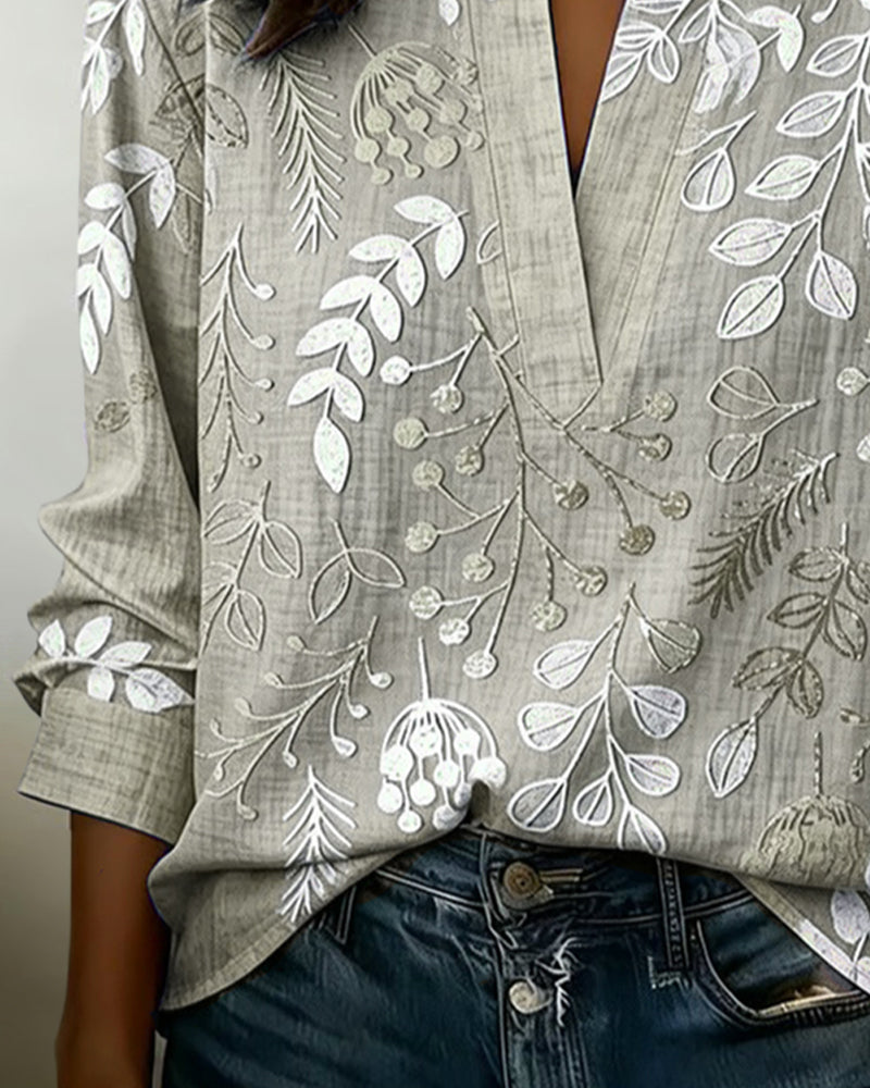 Almudena - Blusa con estampado floral y cuello alto.